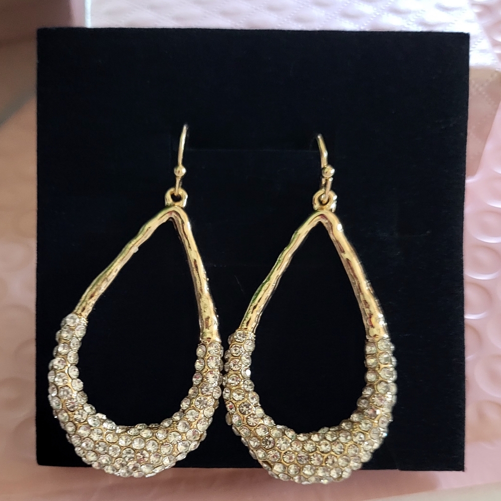 Gold teardrop shaped earrings with cubic zirconia embellishment